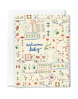 Greeting card with floral patterns and 'welcome baby' text on a white background